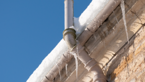 Frozen gutter in the winter